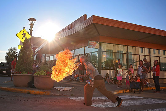 :  Fire Artist  Xavier Joseph Main performs on the corner of North Walnut and Main in Downtown Reedsburg 