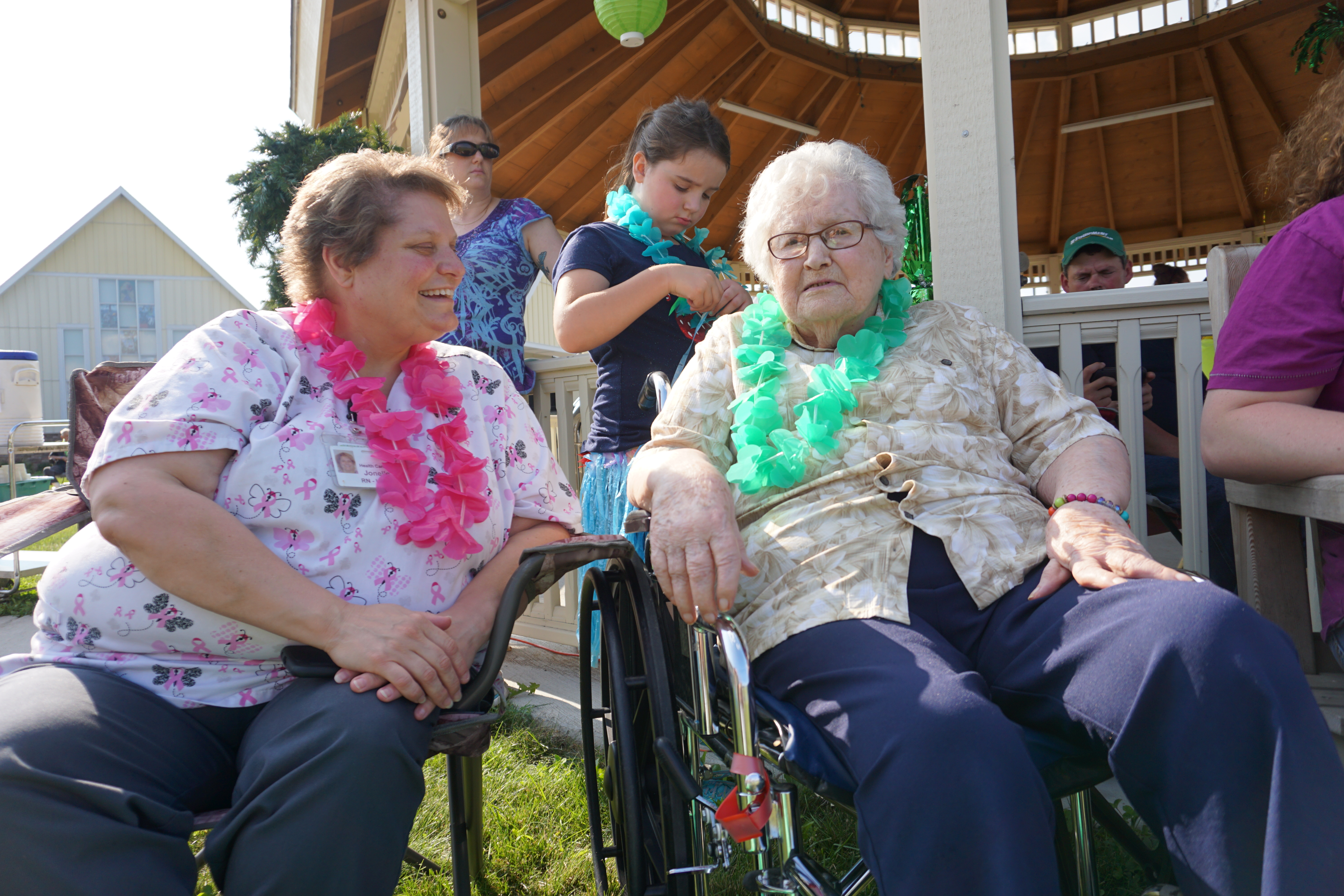 Staff enjoying Luau with resident.