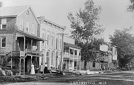 Loganville: Early 1900's. L-R, east side of street: Through the years the first building was a barber shop, doctor's office, pho