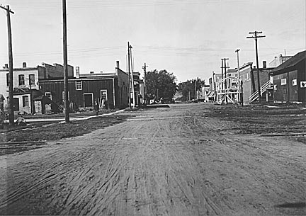 Spring Green: Lexington Street in September, 1922. Note the railroad tracks, lower, and a sign, right, which reads "Watch out th