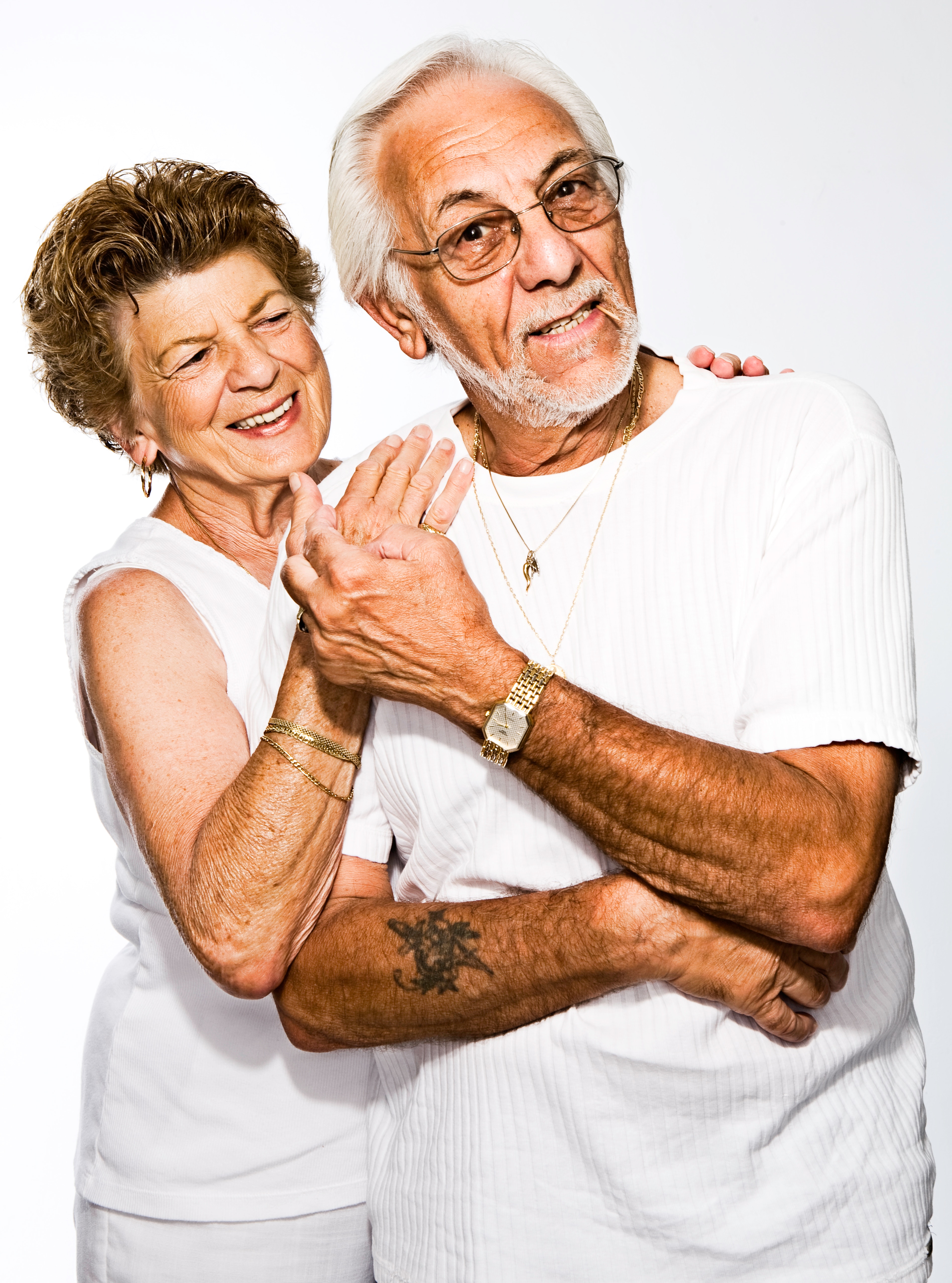 A man and a woman having fun, embracing each other.