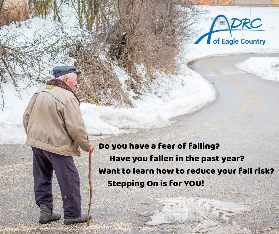 older adult with cane walking on the road in the winter 