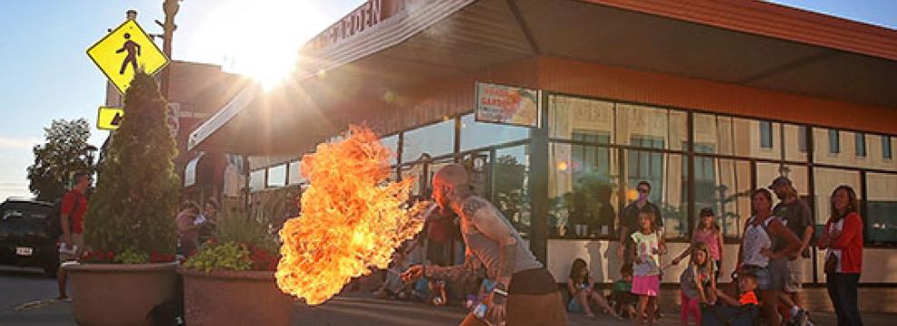 :  Fire Artist  Xavier Joseph Main performs on the corner of North Walnut and Main in Downtown Reedsburg 