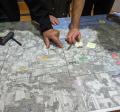 Hands pointing on a map
