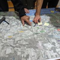 Hands pointing on a map
