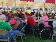 All under the tent during the Family Fun Carnival.