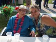 Resident and family enjoy Luau.