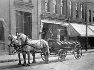 Baraboo: North side of 3rd Street. Effinger Brewery beer wagon in front of Jacob's Palace Barber Shop.