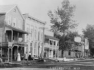 Loganville: Early 1900's. L-R, east side of street: Through the years the first building was a barber shop, doctor's office, pho