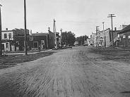 Spring Green: Lexington Street in September, 1922. Note the railroad tracks, lower, and a sign, right, which reads "Watch out th