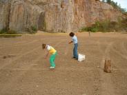Hand seeding in a designated area.