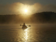 Kayaker in the fog.