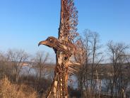 Large soaring eagle made of metal pieces