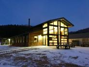 Outdoor view of Prairie Smoke Terrace at night with lights on