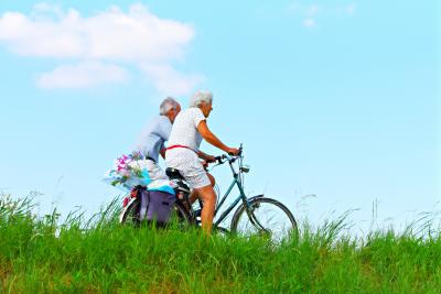 two older people cycling