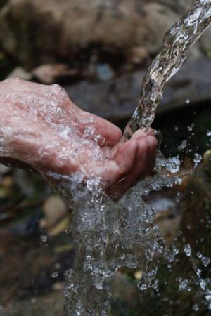 Clear water running over hands