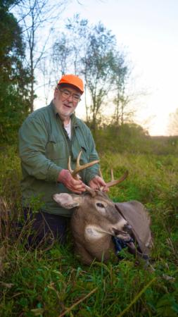 Guido holding his buck that he harvested from the accessible hunting blind at White Mound Count Park. 
