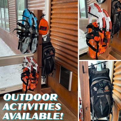 Wooden post with snow shoes, backpacks, and a hammock hanging on it in front of a window Wooden post with snow shoes, backpacks, and a hammock hanging on it in front of a window
