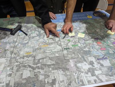 Hands pointing on a map