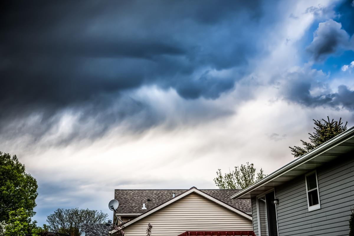 Storm clouds over homes.