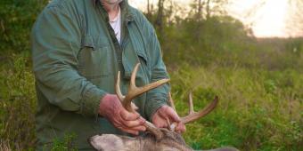 Guido holding his buck that he harvested from the accessible hunting blind at White Mound Count Park. 