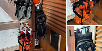 Wooden post with snow shoes, backpacks, and a hammock hanging on it in front of a window