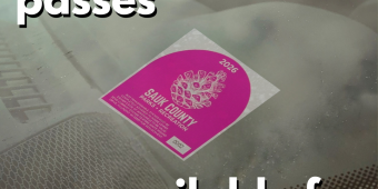 Sauk County Parks annual sticker on car windshield with text reading "free park passes available for veterans"